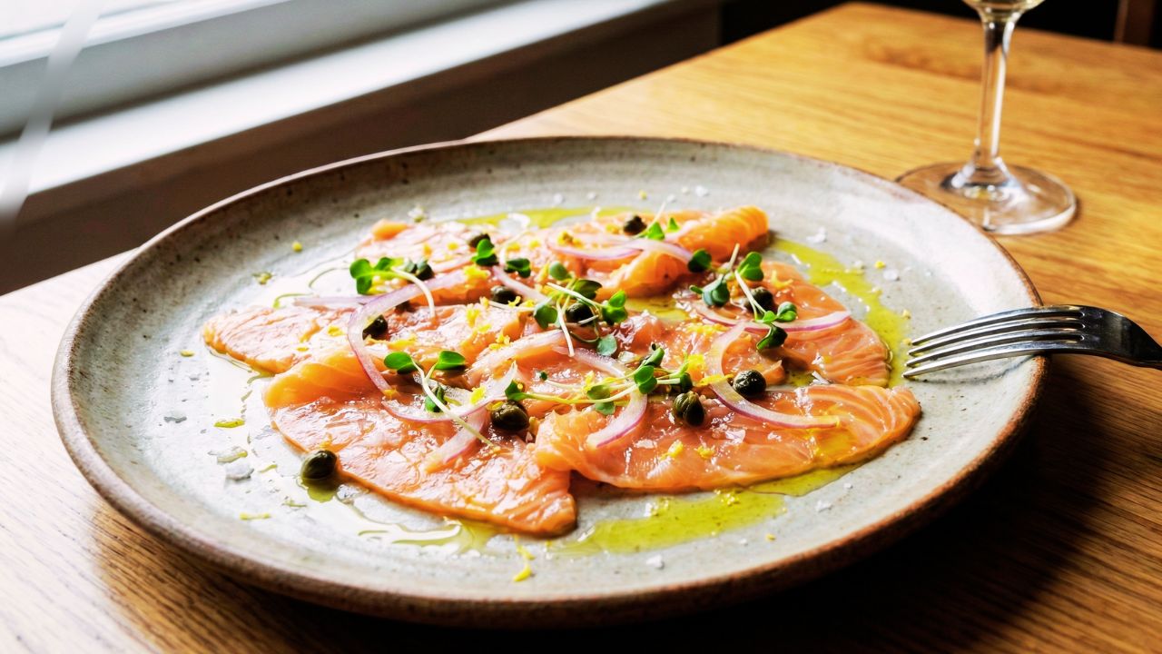 smoked salmon carpaccio with fork good taste